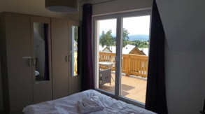Hotel bedroom with view on Lipno Lake